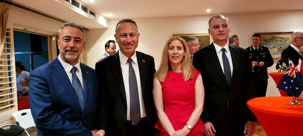 A group of people posing for a photo

Description automatically generated
