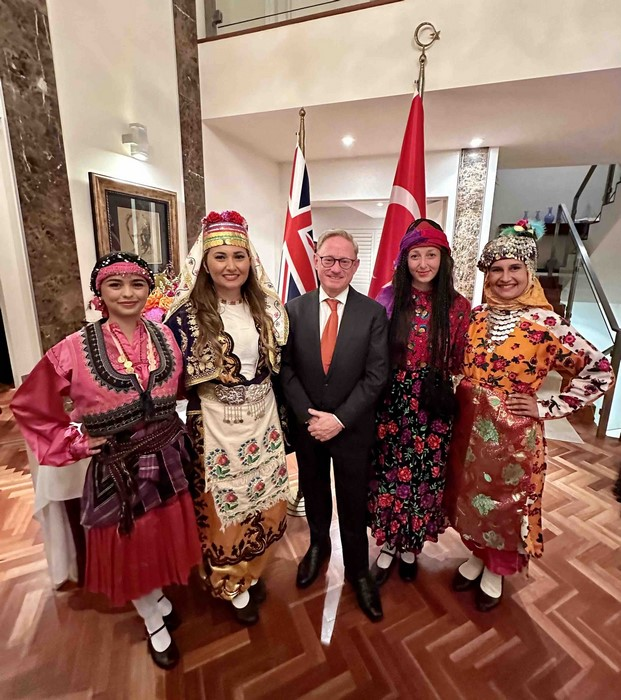 A group of people posing for a photo

Description automatically generated