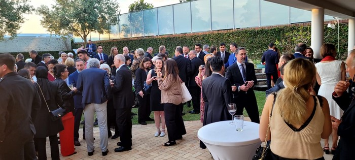 A group of people standing outside

Description automatically generated
