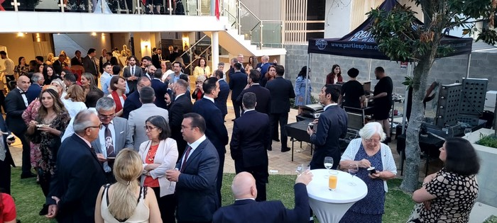 A group of people in suits

Description automatically generated