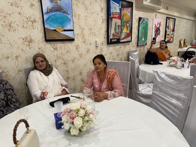 A group of women sitting at a table

Description automatically generated