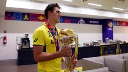 A person holding a trophy

Description automatically generated
