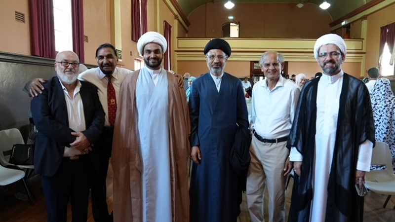 A group of men standing together

Description automatically generated