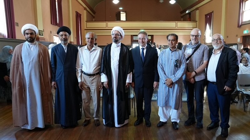 A group of men standing together

Description automatically generated
