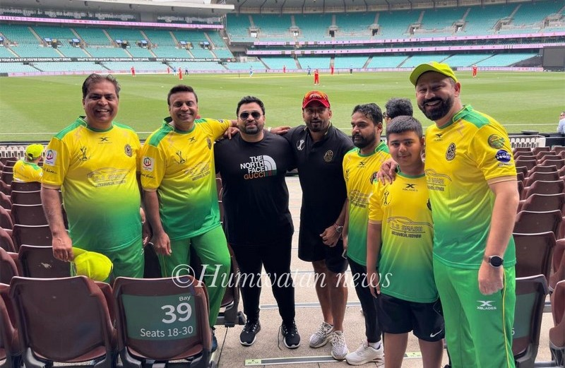 A group of men in sports uniforms
Description automatically generated