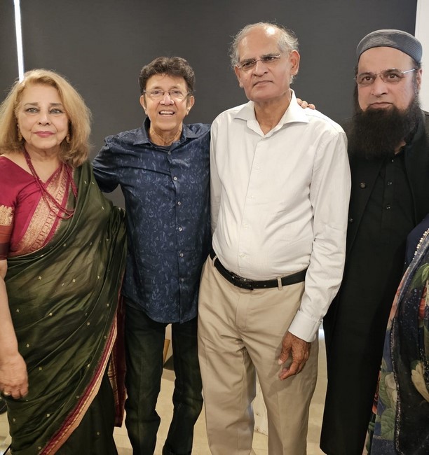 A group of people posing for a photo
Description automatically generated
