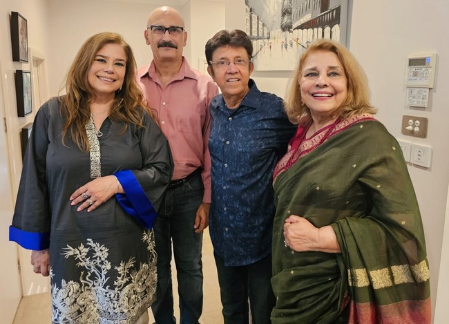 A group of people posing for a photo
Description automatically generated