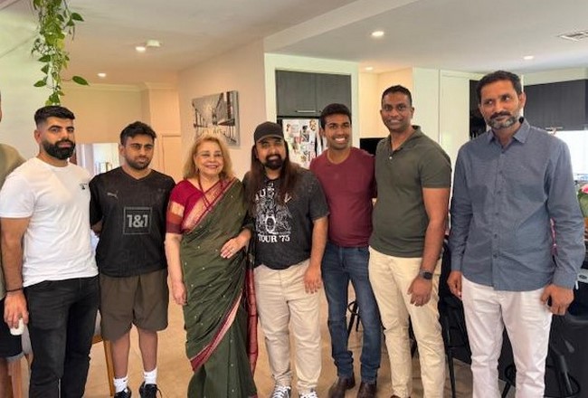 A group of people posing for a photo
Description automatically generated
