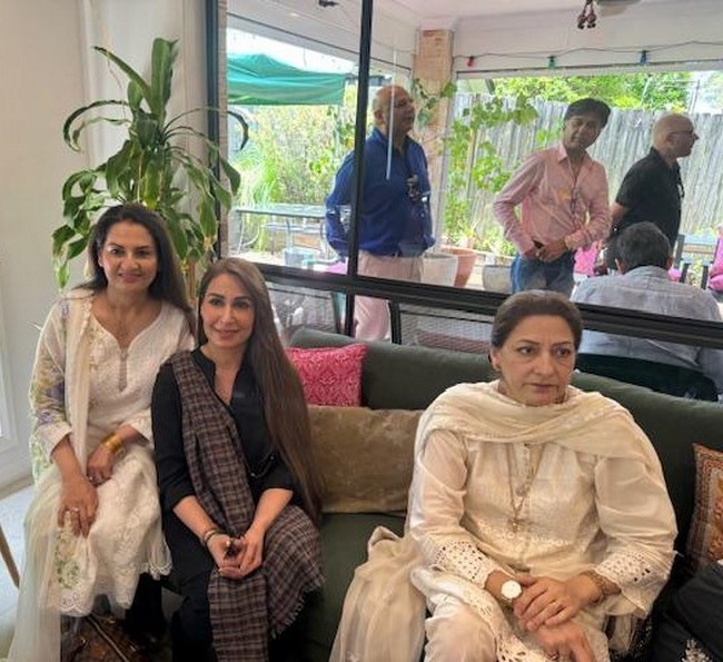 A group of women sitting on a couch
Description automatically generated