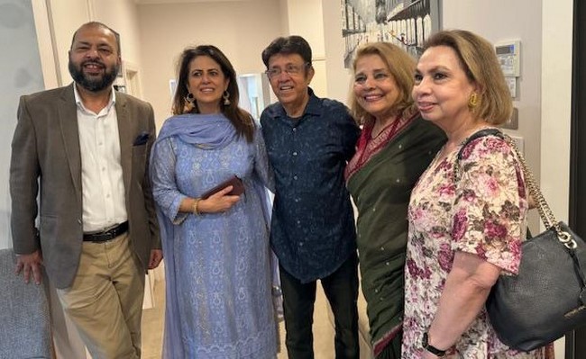 A group of people posing for a photo
Description automatically generated