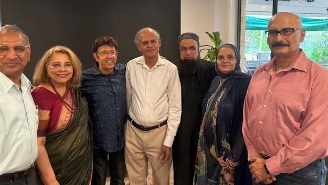 A group of people posing for a photo
Description automatically generated