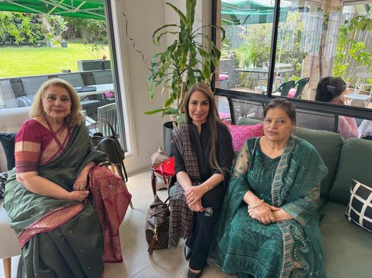 A group of women sitting on a couch
Description automatically generated