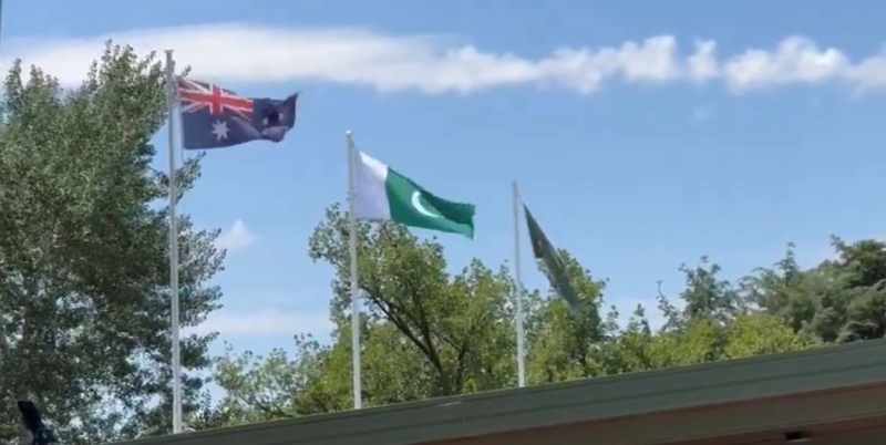 A group of flags flying in the air
Description automatically generated