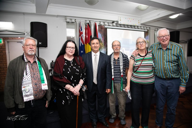 A group of people posing for a photo

Description automatically generated