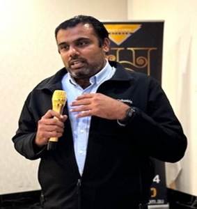 A person holding a microphone
Description automatically generated