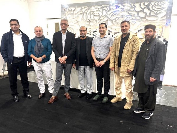 A group of men standing in a line
Description automatically generated