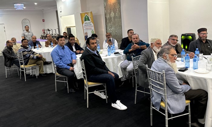 A group of people sitting in chairs
Description automatically generated