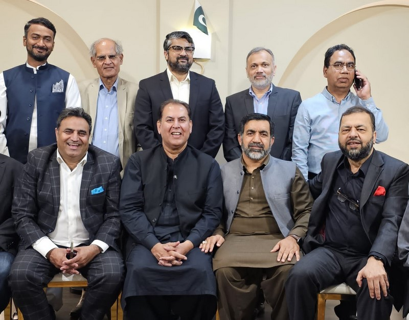 A group of men posing for a photo

Description automatically generated