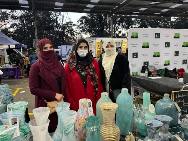 A group of women wearing face masks
Description automatically generated
