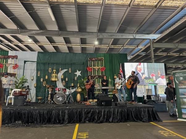 A group of people on a stage
Description automatically generated
