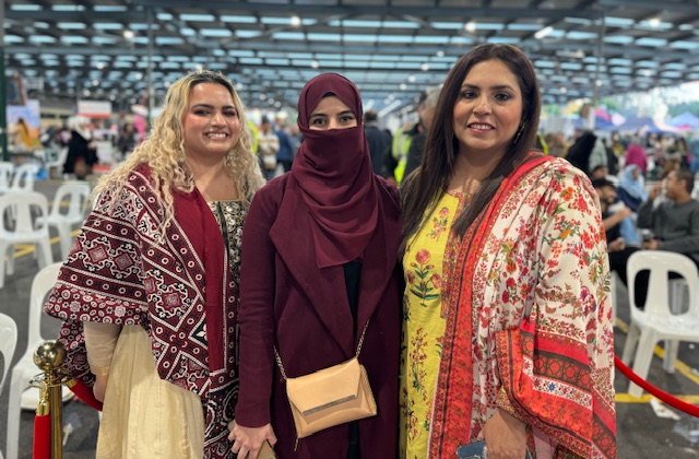 A group of women posing for a photo
Description automatically generated