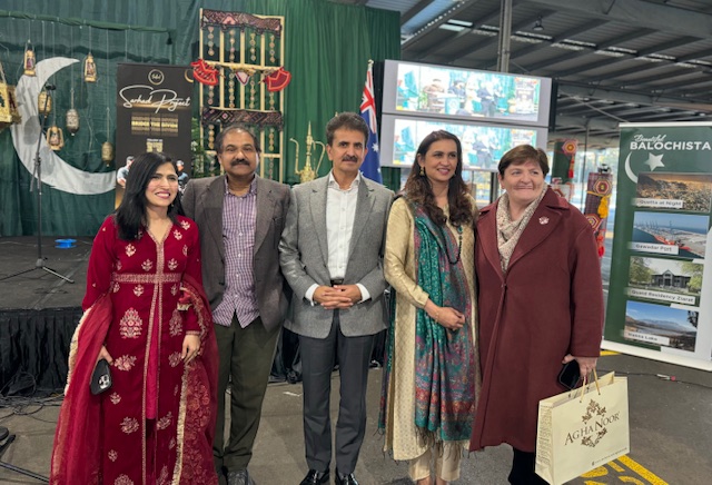 A group of people posing for a photo
Description automatically generated