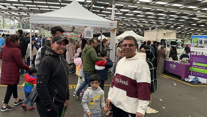 A group of people at a market
Description automatically generated