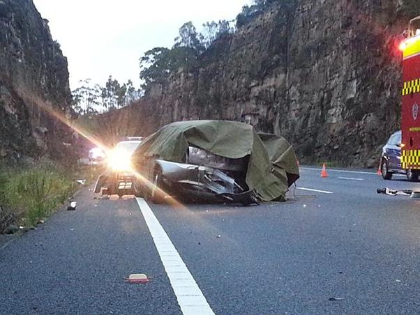 Two men were killed and three others injured after their car slammed into an embankment at Mooney Mooney. Picture: Matt Black...