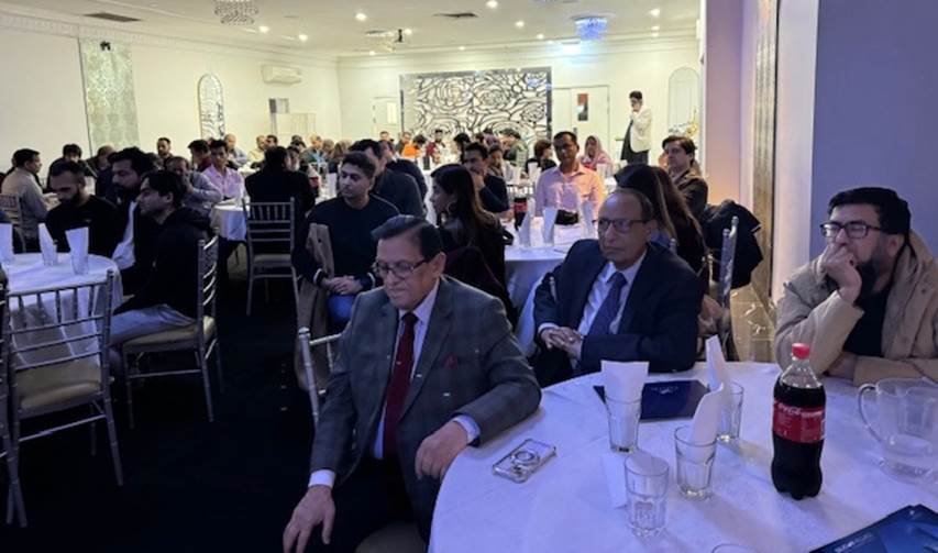 A group of people sitting at tables
Description automatically generated