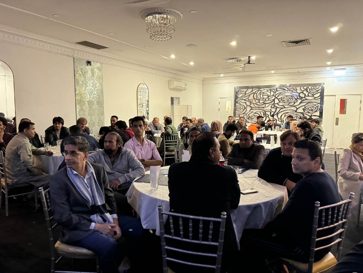 A group of people sitting at tables
Description automatically generated