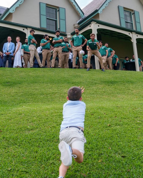 A child reaching for a ball

Description automatically generated