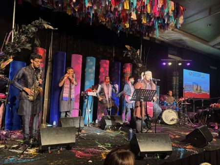 A group of people on a stage
Description automatically generated