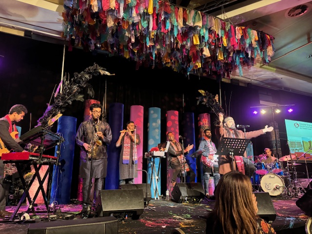 A group of people on a stage
Description automatically generated