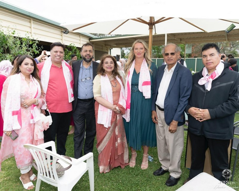 A group of people posing for a photo

Description automatically generated