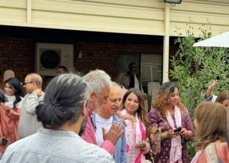 A group of people standing outside

Description automatically generated