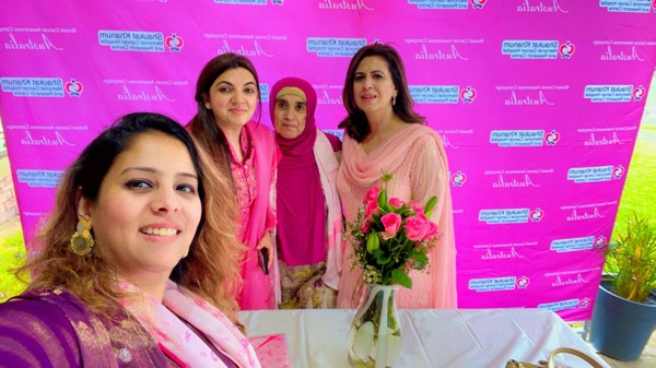A group of women posing for a photo

Description automatically generated