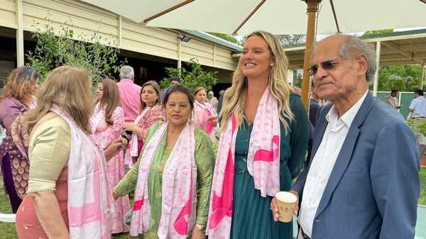 A group of people wearing scarves

Description automatically generated