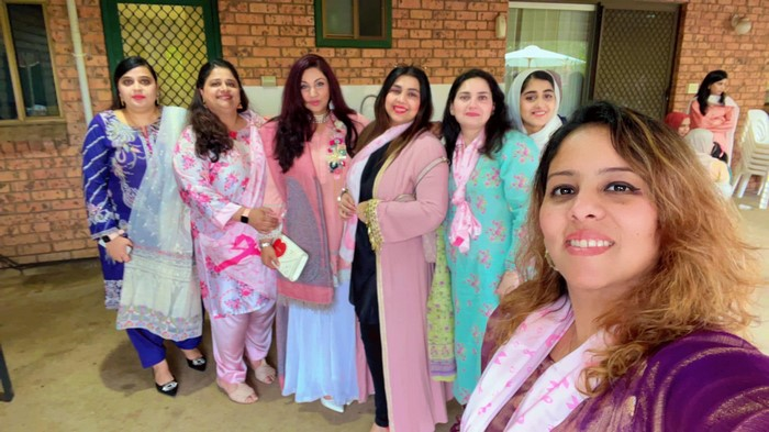 A group of women posing for a photo

Description automatically generated