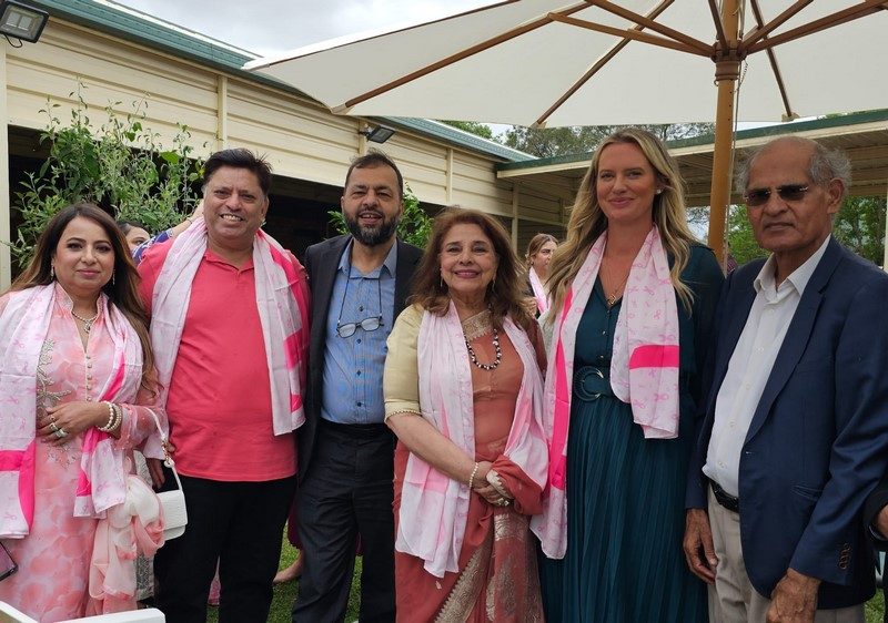 A group of people posing for a photo

Description automatically generated